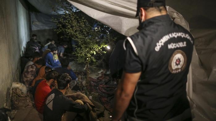 Turkish security forces detain a group of migrants in Van Province, near Turkey’s border with Iran. August 21, 2022.