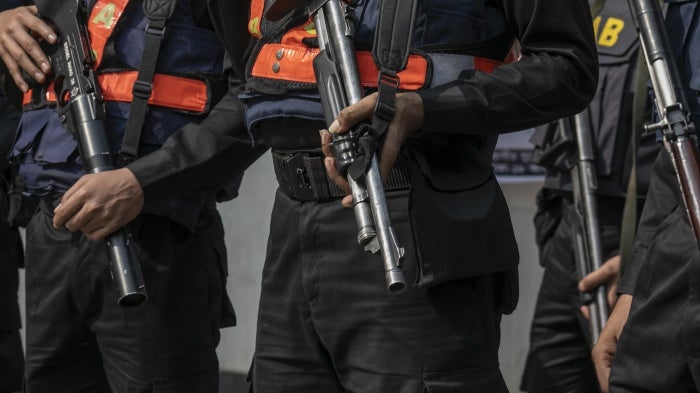 Members of Bangladesh’s paramilitary Rapid Action Battalion or RAB, a unit which is accused of enforced disappearances, stand guard in the capital Dhaka, January 7, 2024.