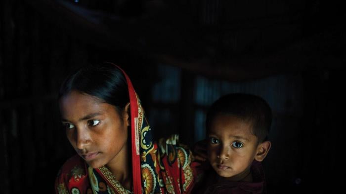 Belkis, 15 years old, holds her one-year-old son in the house where she lives with her mother, two sisters, and one brother. Belkis was married when she was 13 years old to a man who threatened to commit suicide if the family didn’t agree to the marriage.